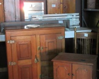 Fantastic assortment of wooden cabinets and antique wooden refrigerator.