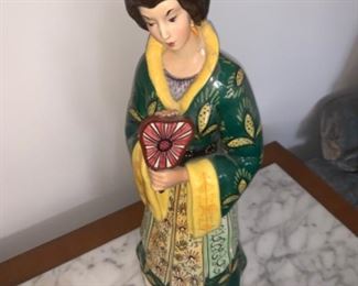 antique Asian statue with neck that has been repaired 