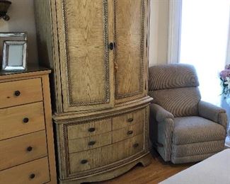 The armoire holds TV or maybe your sweaters 