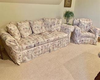 Lilac slip-covered sofa and matching slip covered arm chair and ottoman