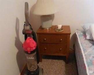 vacuum cleaner, small chest, lamp