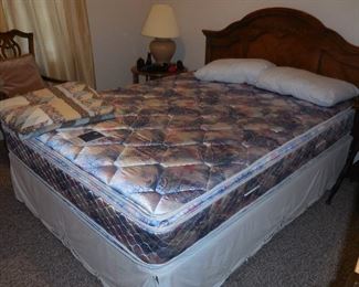 queen mattress set with headboard & frame (a bedskirt is covering the matching mattress foundation)