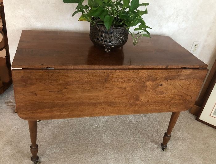 Drop leaf table with brass casters 