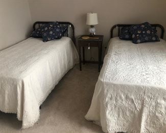 Matching Jenny Lind headboards and very nice twin mattresses. 