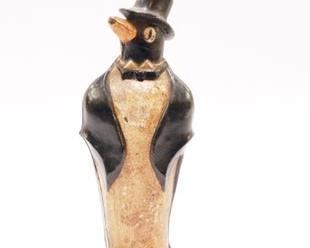 CIRCA 1920'S CAST IRON PENGUIN DOOR STOP IN ORIGINAL PAINT WITH TOP HAT