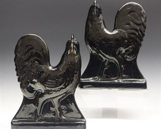 A Pair of 19th Century Jackfield Ware Roosters. Molded bodies with worn gilded detail. Wear and tiny edge flakes, one with firing separation at the comb. Each 12" high.