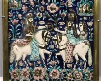 A Persian Glazed Ceramic Tile, Early Qajar Dynasty. Square form molded tile with polychrome glaze in azure, turquoise, brown, white, and pink decorated with floral motifs, architectural features, and figures on horseback. Qajar Dynasty, 1789-1925. Some wear and overall crazing. Tile is 11 1/2 x 11 1/4" high, in a brass frame with some wear, 13 5/8 x 13 1/8" high overall.