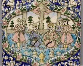 A Persian Glazed Ceramic Tile, Early Qajar Dynasty. Square form molded tile with polychrome glaze in azure, turquoise, green, pink, yellow, with scrolling leaf motifs surrounding a central cartouche which contains an interior scene, most likely from the Shahnameh, with Monarchs and attendants. Qajar Dynasty, 1789-1925. Crazing evident, some chipping around the edges. 16 x 16 1/4" high.