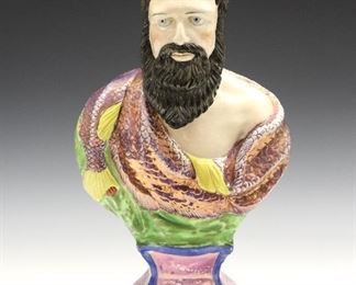 A late 18th/early 19th century Staffordshire Bust of Neptune. Molded body with polychrome decoration and pink lustre detail. Some surface wear, minor flaking at edges of base. 14 1/4" high.