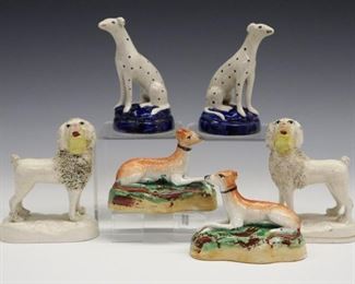 Three pairs of 19th century Staffordshire dog figures includes seated Dalmatians, standing Poodles and resting Whippets. Molded bodies with polychrome decoration. All with minor wear, crazing. Up to 3 3/4" high.