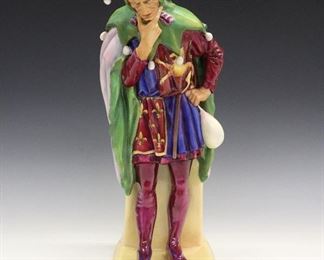 A Royal Doulton Porcelain Figure of Jack Point. Figure depicts the Jester in thought, stamped at the underside with Royal Doulton mark along with initials "RB" and "Jack Point" in gold also impressed "007". Very minor wear. 16" high.