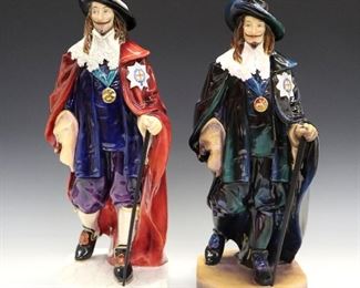 Two Royal Doulton Porcelain Figures of King Charles. Identical figures, but with varying coloration; one is in garments primarily in blue and green and is stamped with Royal Doulton mark along with "King Charles" in gold and "PS" in black. The other has a red cloak and blue garments and is marked "King Charles HN 3459", limited edition no. 132 of 350, artist signed and dated 1996. The shorter with hairline crack in base, minor wear overall. 16 1/2 & 17 1/4" high.
