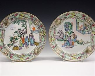 Two 19th Century Chinese Export Porcelain Plates. Each decorated with gilt rims and a multicolored enamel border consisting of parrots, flowers, and geometric patterns which contain scenes at the wells which depict exterior scenes showing figures in various pursuits. Wear to the decoration, one of the plates with a lack of glaze/decoration at one portion (near the flying bird). 9 5/8" diameter.