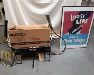 Two tennis rackets, one bike rack and one picture