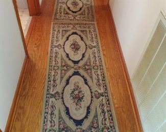 Pretty rugs going down the hall