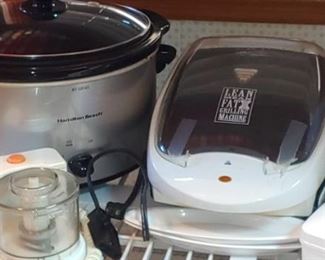 Nice stainless steel crock pot and mean green grilling machine