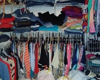 Closet full of designer plus-size clothes ladies
