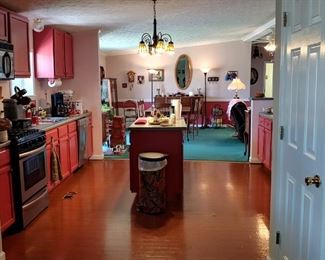 Huge open concept kitchen full of everything you need to cook and serve