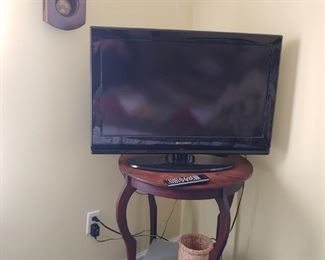 Flat screen TV and antique oak Round Table