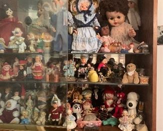 Dolls, dolls, and dolls, this case is stuffed full. ( 8 shelves!) and another case stuffed full! (4 shelves!)