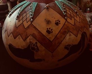 By David Snooks, Washoe tribe.Hand carved, burned and turquoise bead laden gourd