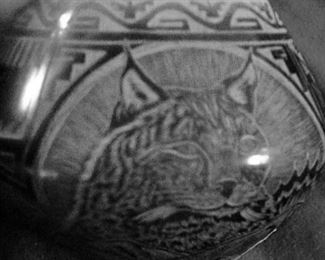 Close up of Santa Clara pot:(difficult to photograph: jewel size) Notice the fine sgraffito carving.
