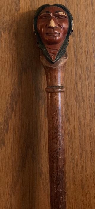 Carved cane with head of a Native American man