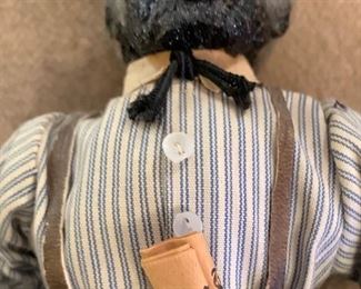 African American doll, holding a newspaper with a Martin Luther King headline.. . hand made clothes