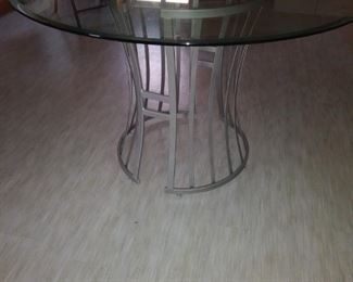 2-pc, 42" beveled edge glass top table with a silver base 