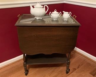 #7	Wood rolling tea cart with removeable glass tray and extending sides. 26"x16"x30"	 $50.00 
