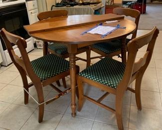 #39	Round table with 4 chairs and one leaf. As is. Needs some work.	 $20.00 
