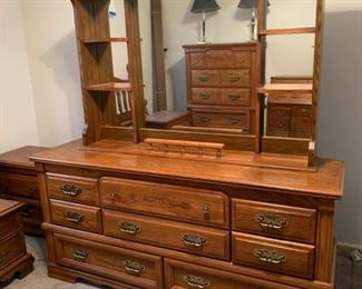 #52	Broyhill dresser, with 8 drawers and a mirror. Solid oak. 66"x18"x73"	 $175.00 
