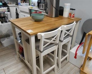kitchen island with two chairs