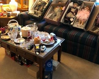 Couch, glass-topped coffee table, lamp, etc.