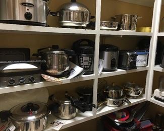 Huge Pantry Full of Everything you can Imagine:
     Cooks Essential Pressure Cooker
     Wolfgang Puck Rice Cooker
     Rival Crock Pot
     Digital Air Fryer - Todd English
    Oster Blender
    Hamilton Beach Slow Cooker
    Ultrex Pressure Cooker 
    Toastmaster Convection Oven
    Kitchen Aid Convection Oven