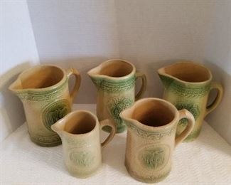 Pottery pitcher collection - yellow ware and green