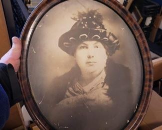 Antique oval burled wood frame with b&w pic of lady wearing a hat