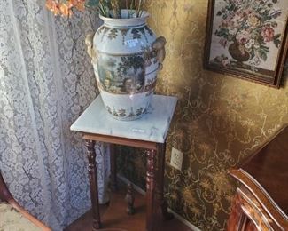 Stand with granite top, Beautiful vase,  framed tapestry. also the chair to the left.