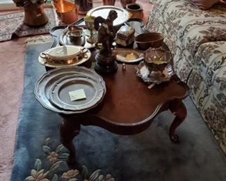 Rug, lots of silver, pewter & copper items.  Coffee table and couch also available. There are actual 2 matching couches.