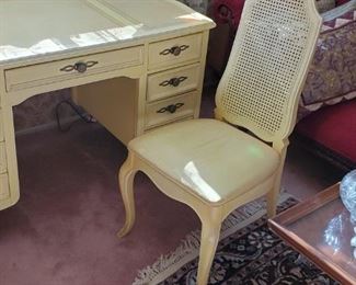 Antique desk , chair, lamp , rug and also the antique coffee table to the right.