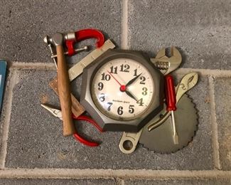 mess of magnetized tools with clock in center