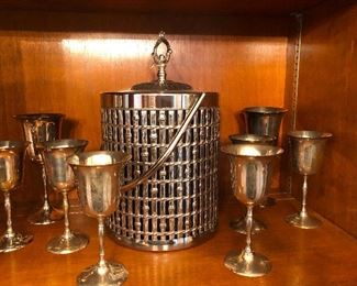 Vintage ice bucket and eight silver goblets for drinking from when participating in evil rituals