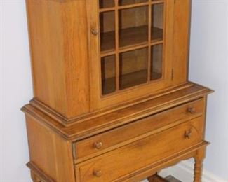 Side view  of antique china cabinet.  