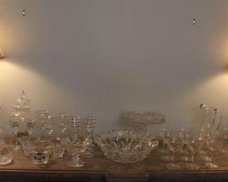 Large amount of glassware with pair of lamps.  