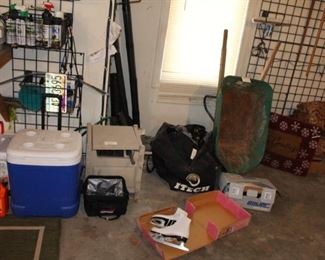 Ice skates, cooler, hose and reel, roller hockey equipment, wheelbarrow