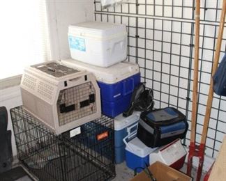 Coolers and dog crates, post hole digger