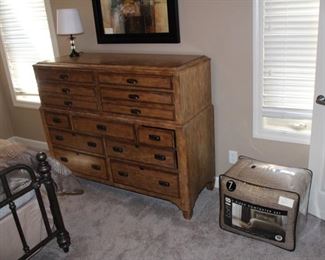 Thomasville chest of drawers shown with queen size bedding.  