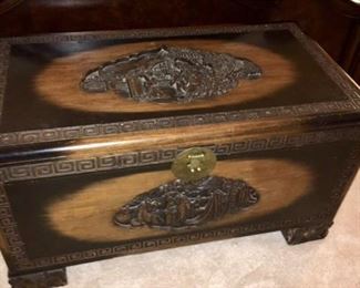 Intricately carved trunk with insert