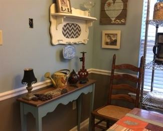 narrow table    wall shelf with hooks   cane bottom chairs and others    