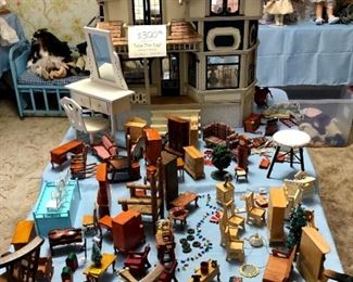 An entire room of dolls (most from 60's to 2000) , large doll house, and doll house furniture. Early metal crib and stroller.